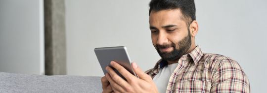 Man checking tablet