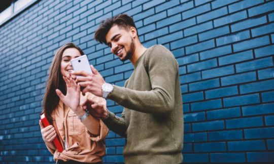Young people looking at phone
