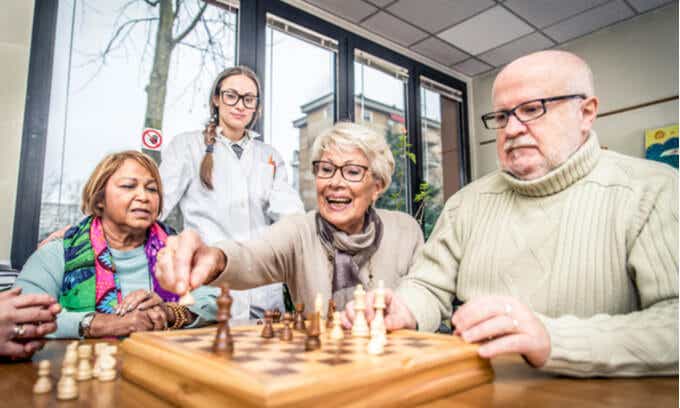 A group of elderly people playing chess
