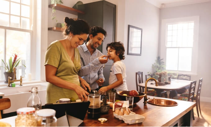 A young family in a kitchen