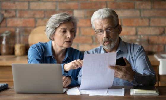 A retired couple check their Age Pension payments