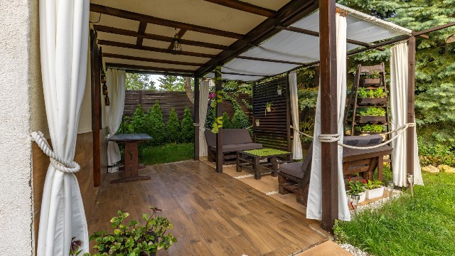 garden with a gate and pergola
