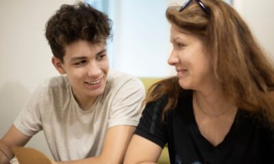 A mother and son representing how long can you stay on your parents' health insurance australia.