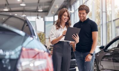 An image of a young salesperson with another person, representing the title, “How much can I borrow for a home loan?”
