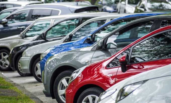 A row of cars representing multi car insurance.
