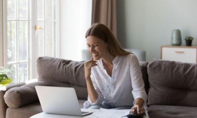 A woman working on her laptop representing personal loans for low income earners.