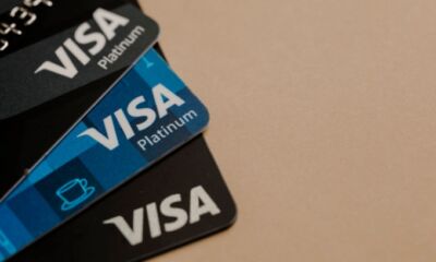 A stack of Visa platinum credit cards.