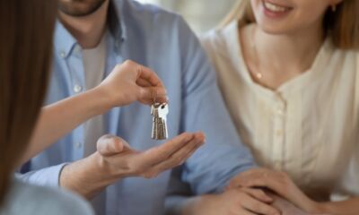 A landlord hands a tenant a set of keys after thinking what is a private rental?