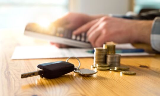 Someone calculates car loan balloon payments.