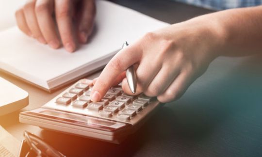 person calculating pay