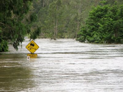 floodwaters surge across main road in regional Australia