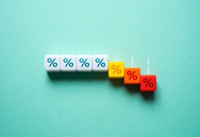 Plastic blocks with percentage sign progressively dropping down.